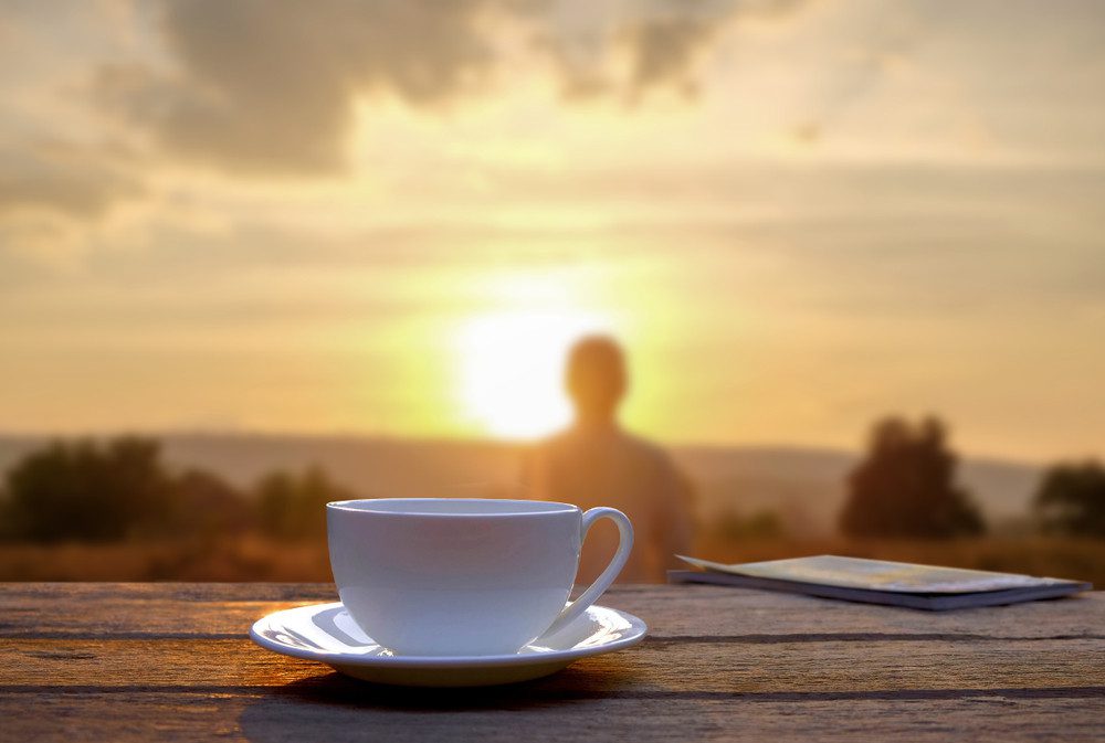 morning sun and cup of coffee on deck