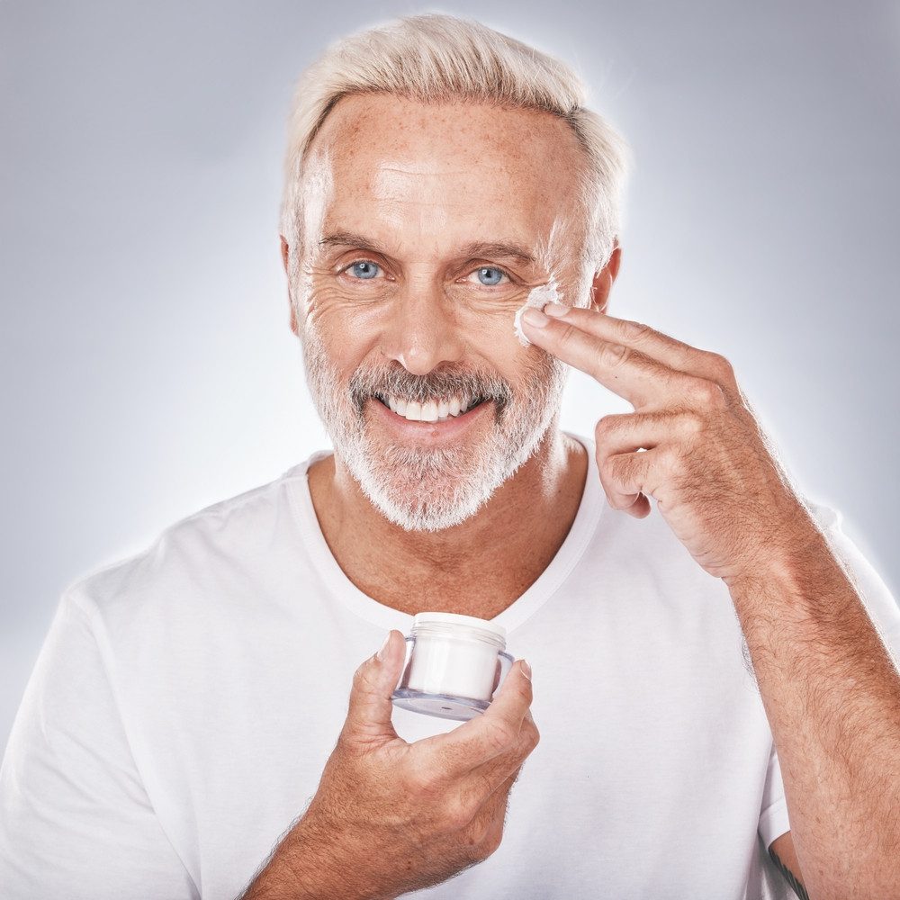 man using skincare product
